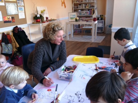 Anne Freeman with kids in her new arts studio
