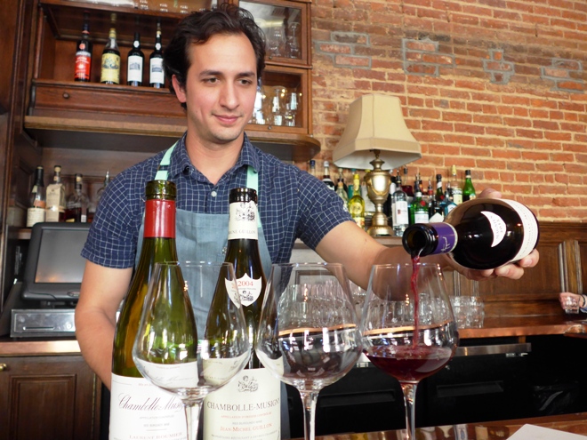 Andrew Wooldridge pouring wines from Chambolle-Musigny