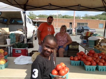 Keonte Murphy - a new tomato lover at the CHEW Farmers Market in Anacostia