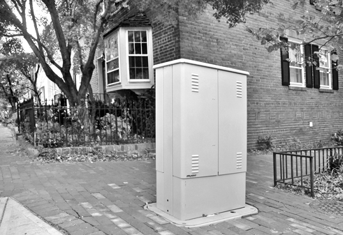 A Comcast box at 29th and Olive streets is one of several installed in the historic district without design review.