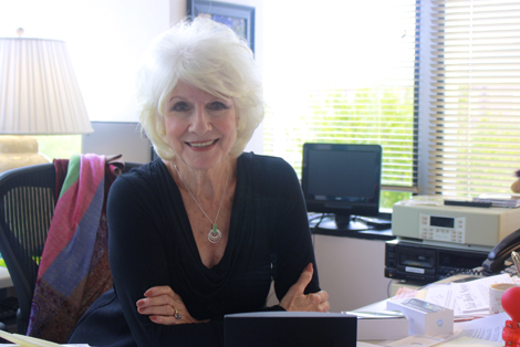 Diane Rehm, host of The Diane Rehm Show, sits at her desk