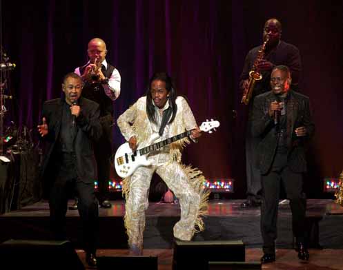 Verdine White on Bass flanked by other band members