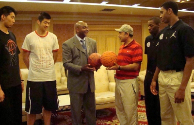 The friendly aftermath in Beijing: Coach Thompson, Hoya players Jason Clark &amp; Hollis Thompson exchange signed basketballs.