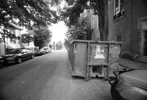 One complaint from residents is that dumpsters take up parking spots on already-crowded roads.