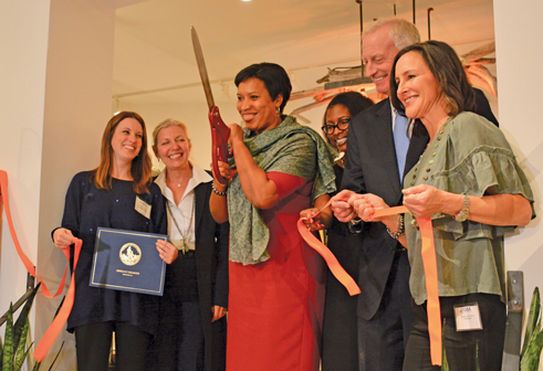 Mayor Muriel Bowser, center, addressed the new Georgetown Main Street group at its ribbon-cutting last Wednesday.