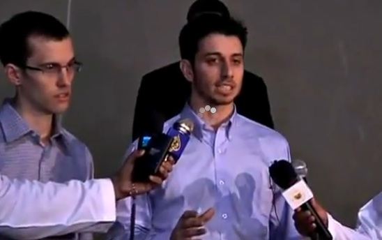 Freed hikers speak to reporters after landing in Oman