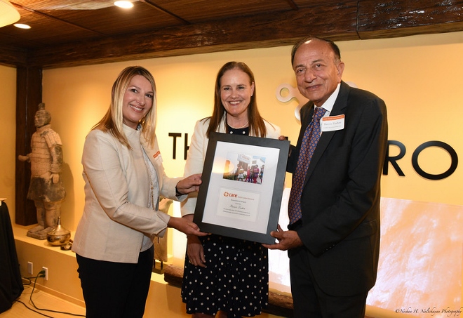 Ranvir Trehan receives CARE&#039;s Humanitarian Award from Heather Higgenbottom (left) and Michele Flournoy