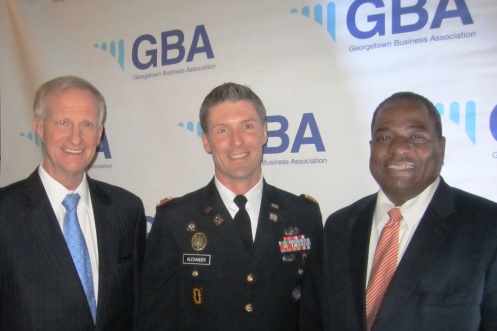 Major David Alexander, US Army, is flanked by Councilmembers Jack Evans and Vincent Orange