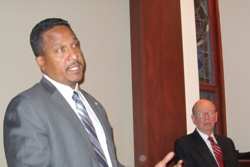 US Attorney Ronald C. Machen Jr. addresses ANC 2E, as Chair Ron Lewis looks on