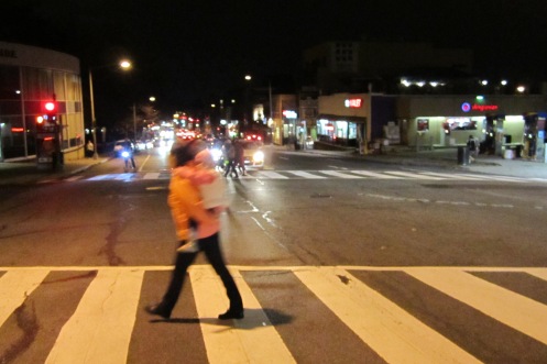 Looking south at Wisconsin Ave and Calvert St as a pedestrian crosses