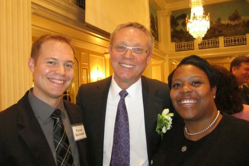 Tom Sherwood, the honoree, with proud son Payton (left) and DC School Chancellor Kaya Henderson