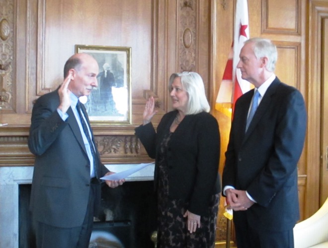 Council Chair Mendelson (left) swears-in Kathy Patteerson as DC Auditor, as Councilmember Jack Evens looks on