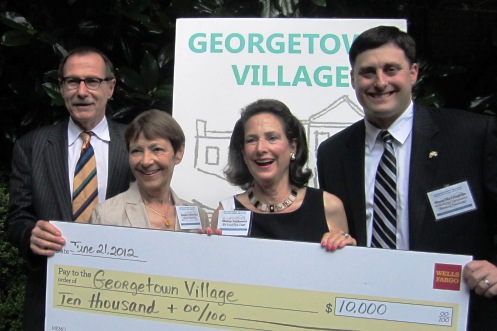 Jessica Townsend (second from left) and Sharon Lockwood with the check from Wells Fargo&#039;s Bob Chlebowski and Shane McLaughlin