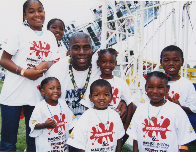 Magic Johnson surrounded by kids