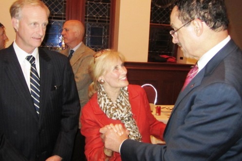 After the meeting, Linda Greenan (in red) of GU talks to Mayor Gray (right) as Councilmember Evans looks on