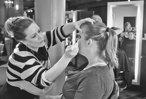The women, who were treated to free makeovers Sunday at Bang Salon, anticipate their spouses’ return from Afghanistan in March.