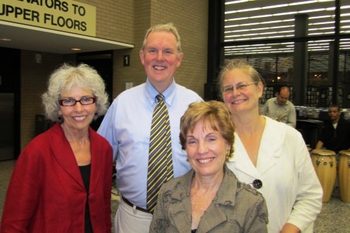 Councilmbmember Tommy Wells (center) with Chief Librarian Ginnie Cooper and library supporters Susan Haight and Robin Diener.