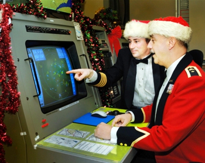 Col Pierre Ruel and BGen Christian Barabé check the radar screen in preparation for tracking Santa Claus