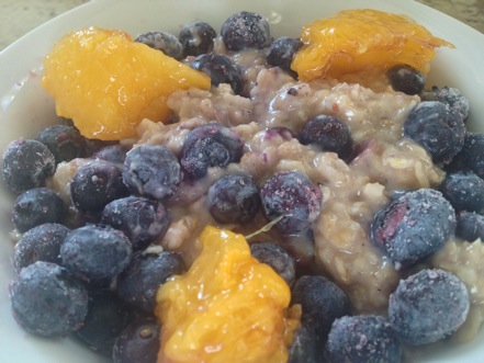 I start each day with a filling bowl of oatmeal made with old fashioned rolled oats, milk, fruit and nuts