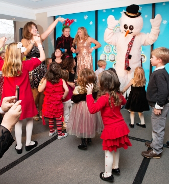 Pamela Stanley performing with children