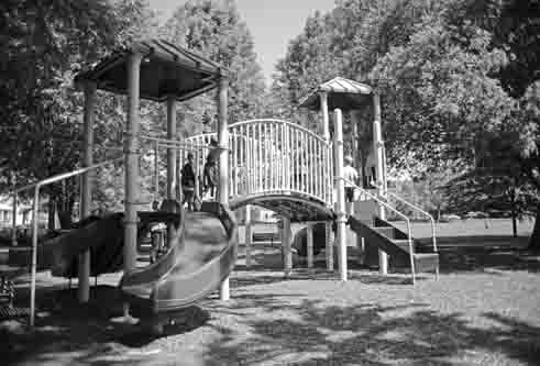 A new play structure with two slides and six swings will replace the current model shown here.