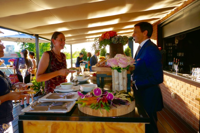 Rosewood Managing Director Pascal Forotti greets guests at the Rooftop Bar &amp; Lounge