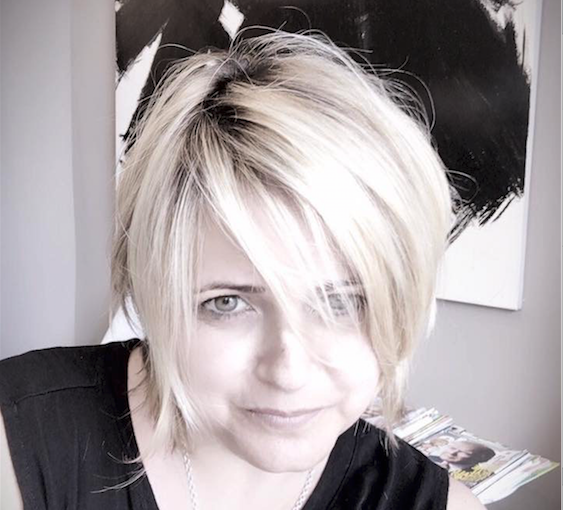 Sandra Villoteau Gomezand, Co-Owner of Salon Rive Gauche, sporting a layered Bob by Stylist, Tami Iams