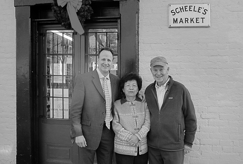 Malcolm Peabody, right, helped lead the effort to help keep Kye Lee operating Scheele’s, now owned by Jordan O’Neill, left.