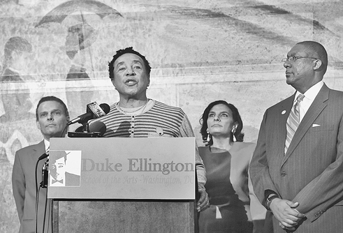 R&amp;B artist Smokey Robinson, with Ellington principal Rory Pullens, far right, spoke about the importance of arts education.