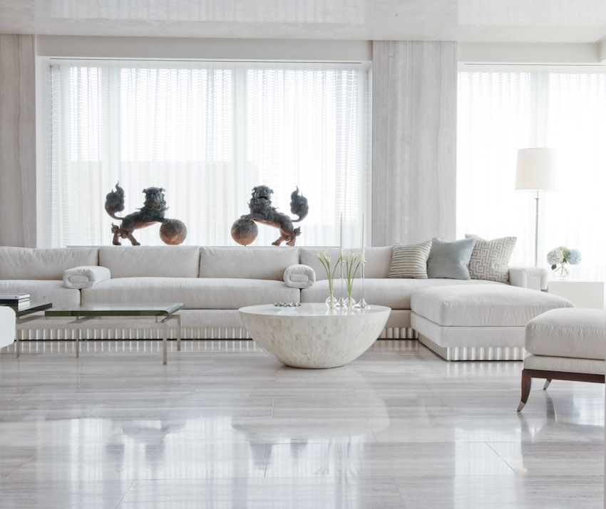 Living room features travertine floor and walls, a waxed Venetian-plaster ceiling and custom-made sofa.