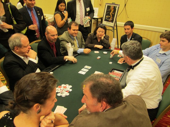 Guests gathered around gaming tables at the 5th Annual High Rollers Night to benefit CSAAC