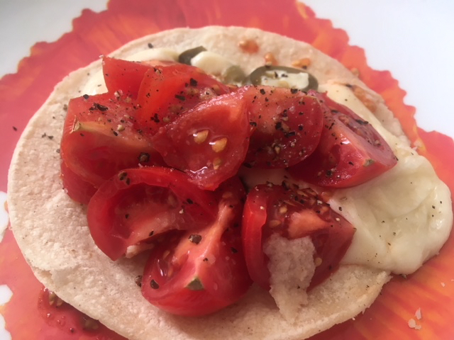 Easy Tacos with Light Cheese, Chopped Tomatoes, Onions, and Jalapeno Peppers