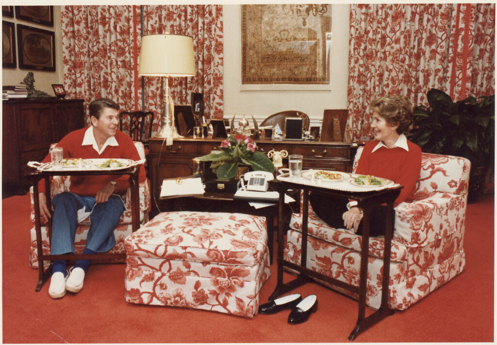 The Reagans dining off of TV trays in the White House, 1981