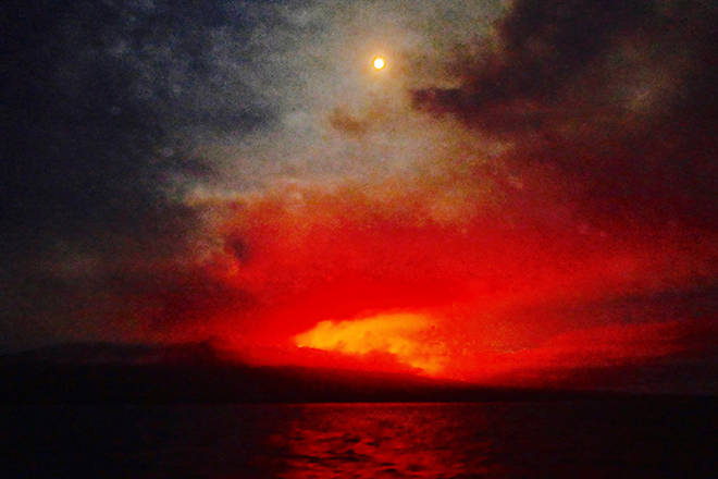 Full moon over Fernandina Island Erupting Volcano