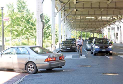 The removal of metered parking spaces below the Whitehurst Freeway would allow a dedicated bike lane.