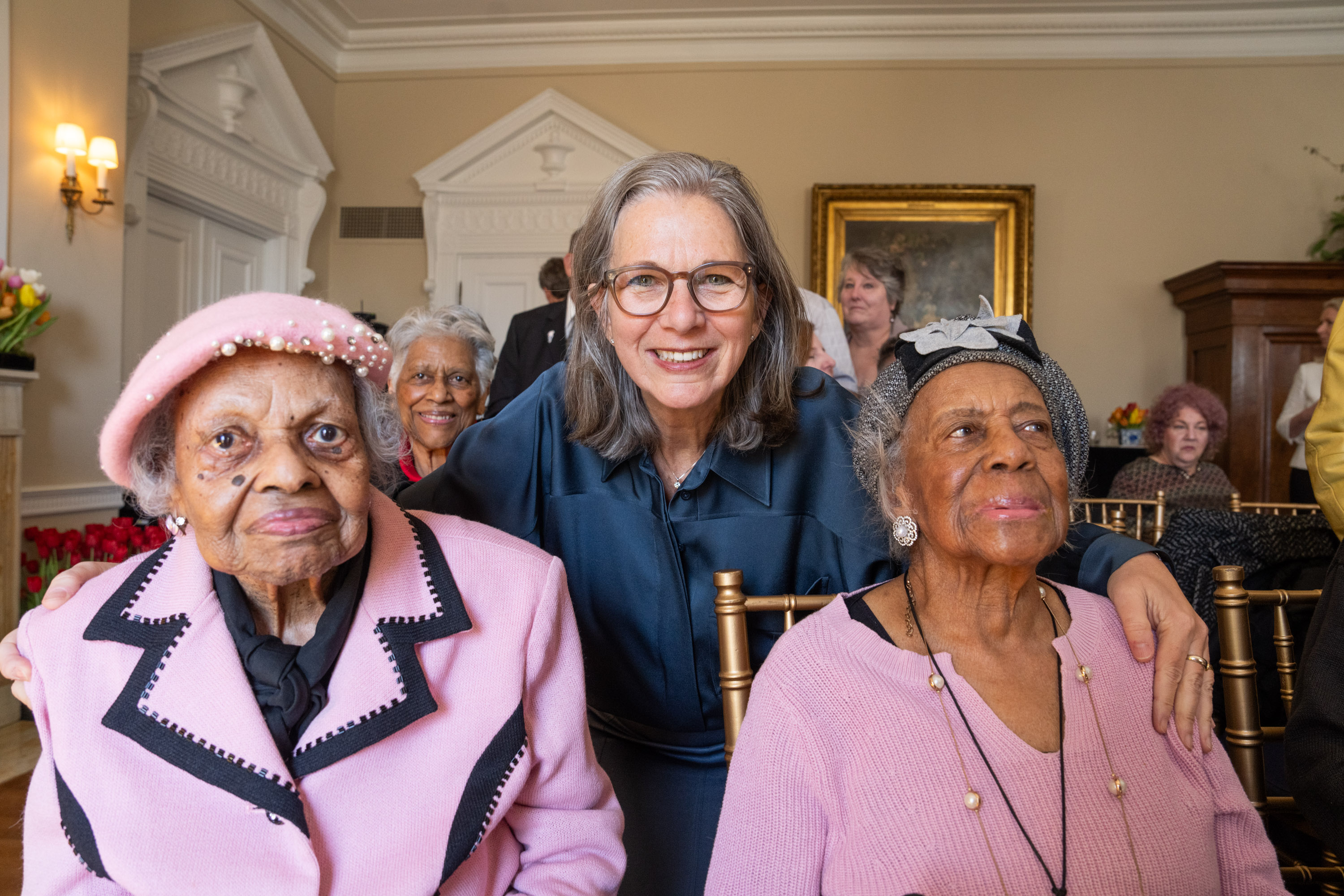 Dorothy Boggess is on the left of Ambassador Birgitta Tazelaar, Velma Long is on the right