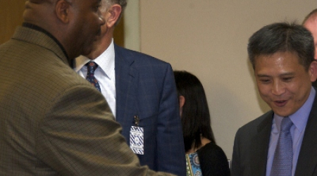 Coach Thompson (left) &amp; GU Board of Directors Chairman Paul Tagliabue discuss trip with Kin Moy