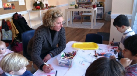 Anne Freeman with kids in her new arts studio