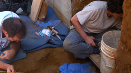 Michael McGinnes, left, and Ruth Trocolli work on excavating the Q Street burials site.