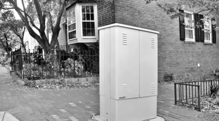 A Comcast box at 29th and Olive streets is one of several installed in the historic district without design review.