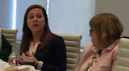 US Army Veteran Brandy Schantz speaks out as Women in Housing and Finance President-elect Martha Clarke listens