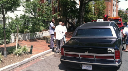 The careening cab comes to rest at the curb