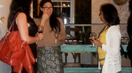 Guests enjoying wine and Fleurir chocolates