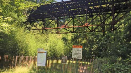 Although pedestrians can easily access the closed trail, officials say it’s dangerous to pass under the deteriorating bridge.