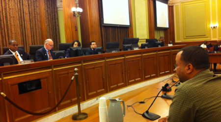 Hatmaker Anthony Gaskins testifies before a Committee hearing led by Councilmember Vincent Orange