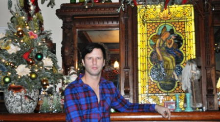 Don Patron at original Tiffany carved bar with stained glass