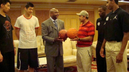 The friendly aftermath in Beijing: Coach Thompson, Hoya players Jason Clark &amp; Hollis Thompson exchange signed basketballs.