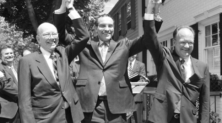 ANC chair Ron Lewis, Mayor Vincent Gray and GU president John DeGioia celebrate at a June announcement of the agreement.