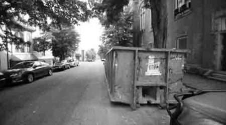 One complaint from residents is that dumpsters take up parking spots on already-crowded roads.