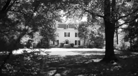 The owners of the 1864 mansion have scaled back their plans, but the Old Georgetown Board still has concerns.